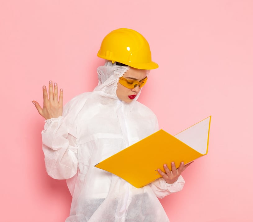 Female technician holding yellow file folder